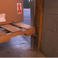 Forklift Pallet Crashing Dock Door Rail